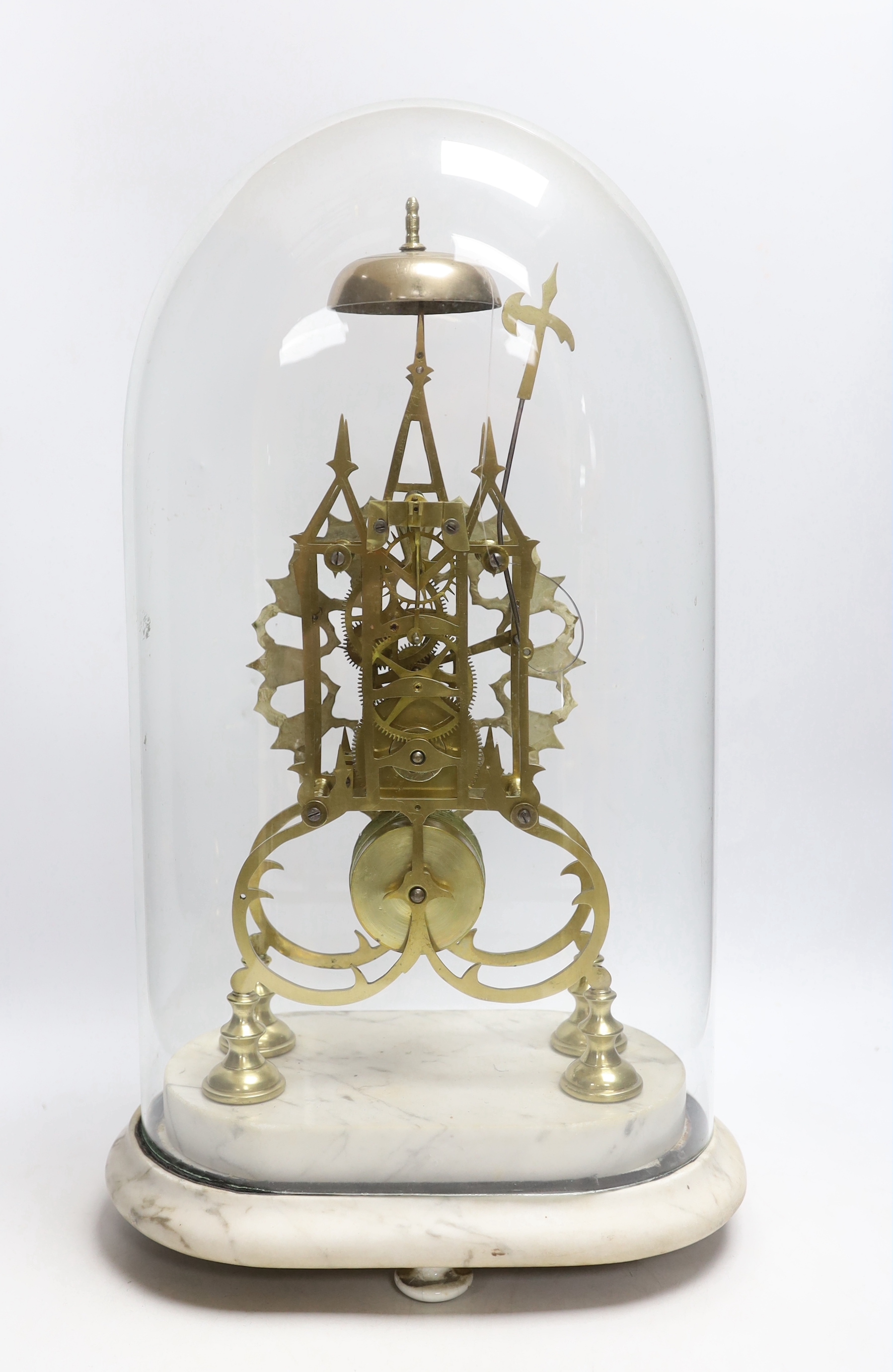 A 19th century brass skeleton clock under dome on shaped grey marble base, 49cm high